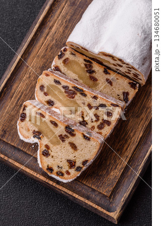 Stollen, a German Christmas pastry for the winter holidays. Stollen as a food background 134680051