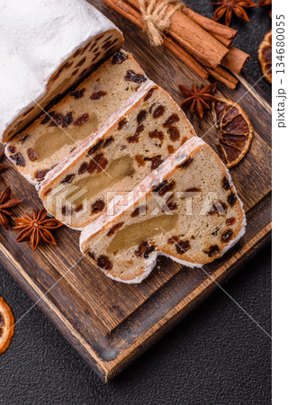Stollen, a German Christmas pastry for the winter holidays. Stollen as a food background 134680055