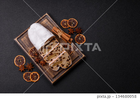 Stollen, a German Christmas pastry for the winter holidays. Stollen as a food background 134680058