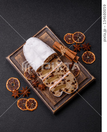 Stollen, a German Christmas pastry for the winter holidays. Stollen as a food background 134680059