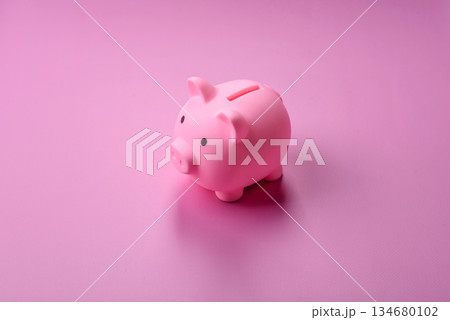 A piggy bank as a concept for storing, accumulating, and saving financial resources. A piggy bank A piggy bank as a concept for storing, accumulating, and saving financial resources. A piggy bank 134680102