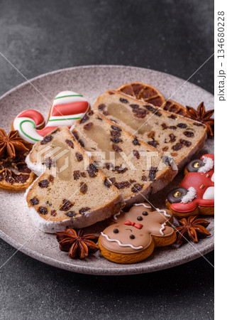 Stollen, a German Christmas pastry for the winter holidays. Stollen as a food background 134680228