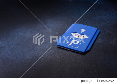 A parking disc, permit, or ticket for measuring time and paying municipal services. A parking disc 134680252