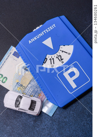 A parking disc, permit, or ticket for measuring time and paying municipal services. A parking disc 134680261