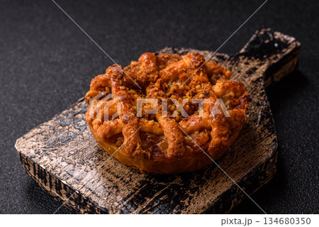 Apple or pumpkin pie or tart is a sweet American autumn treat. American apple pie Apple or pumpkin pie or tart is a sweet American autumn treat. American apple pie 134680350