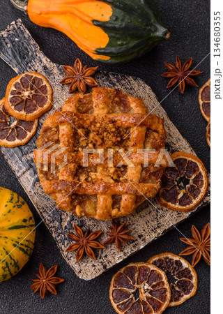 Apple or pumpkin pie or tart is a sweet American autumn treat. American apple pie Apple or pumpkin pie or tart is a sweet American autumn treat. American apple pie 134680355