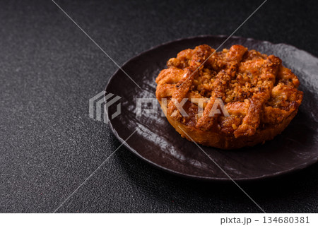 Apple or pumpkin pie or tart is a sweet American autumn treat. American apple pie Apple or pumpkin pie or tart is a sweet American autumn treat. American apple pie 134680381