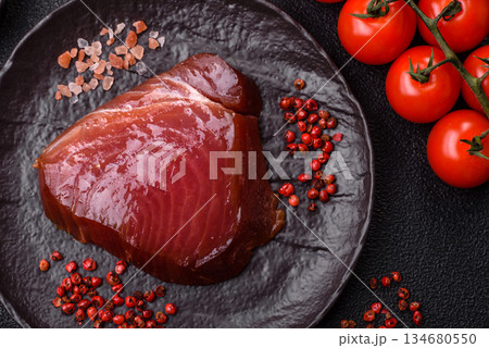 Tuna steak for sashimi or sushi, smoked fish. Tuna steak as a food background Tuna steak for sashimi or sushi, smoked fish. Tuna steak as a food background 134680550
