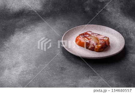 Tuna and salmon roll, smoked fish. Tuna and salmon roll as a food background Tuna and salmon roll, smoked fish. Tuna and salmon roll as a food background 134680557
