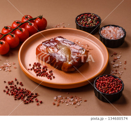 Tuna and salmon roll, smoked fish. Tuna and salmon roll as a food background Tuna and salmon roll, smoked fish. Tuna and salmon roll as a food background 134680574
