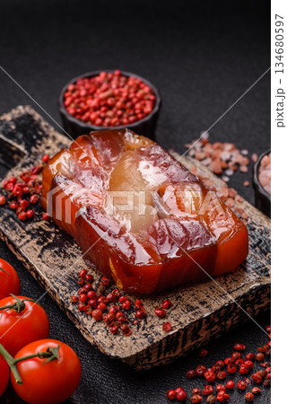Tuna and salmon roll, smoked fish. Tuna and salmon roll as a food background Tuna and salmon roll, smoked fish. Tuna and salmon roll as a food background 134680597
