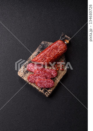 Smoked salami slices, beef or chicken sausage for sandwiches. Salami slices Smoked salami slices, beef or chicken sausage for sandwiches. Salami slices 134680726