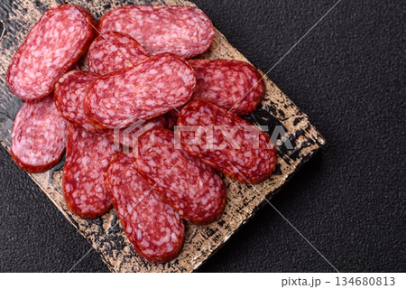 Smoked salami slices, beef or chicken sausage for sandwiches. Salami slices Smoked salami slices, beef or chicken sausage for sandwiches. Salami slices 134680813