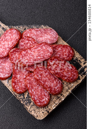 Smoked salami slices, beef or chicken sausage for sandwiches. Salami slices 134680814