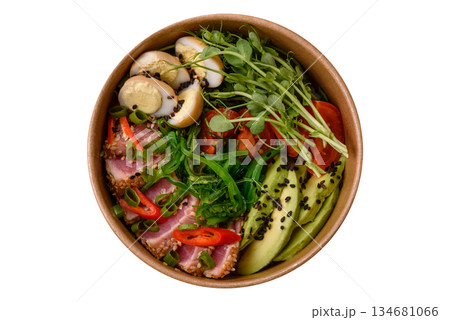 Seared tuna tataki in a bowl with sesame seeds, rice, and vegetables. Tuna tataki Seared tuna tataki in a bowl with sesame seeds, rice, and vegetables. Tuna tataki 134681066