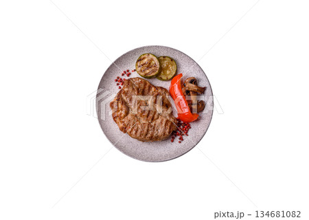 Grilled beef or pork steak, healthy restaurant food for lunch. Barbecue steak as a background Grilled beef or pork steak, healthy restaurant food for lunch. Barbecue steak as a background 134681082