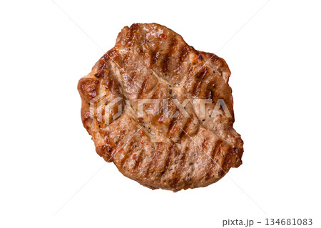 Grilled beef or pork steak, healthy restaurant food for lunch. Barbecue steak as a background 134681083