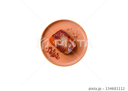 Tuna and salmon roll, smoked fish. Tuna and salmon roll as a food background Tuna and salmon roll, smoked fish. Tuna and salmon roll as a food background 134681112
