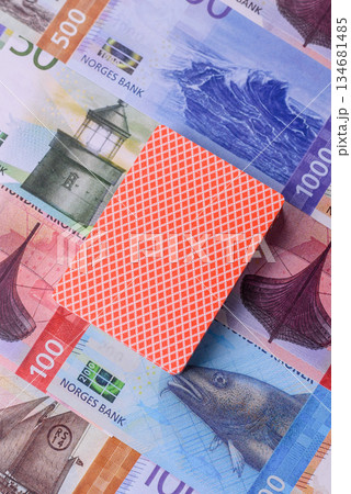 Casino game in the Norway, Norwegian krone money, chips, cards. Gambling in casinos in the Norway Casino game in the Norway, Norwegian krone money, chips, cards. Gambling in casinos in the Norway 134681485