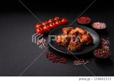 Hake fish cooked in pieces in tomato sauce, stew with peppers and carrots. Hake fish in tomato Hake fish cooked in pieces in tomato sauce, stew with peppers and carrots. Hake fish in tomato 134681513