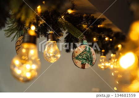 Handmade Christmas tree ornament with warm fairy lights 134681559