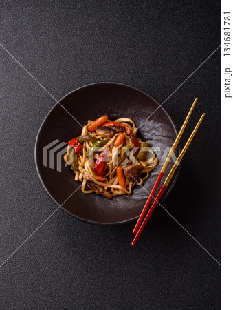 Asian food, noodles with vegetables, vegetarian dish with spicy sauce. Noodles with vegetables 134681781