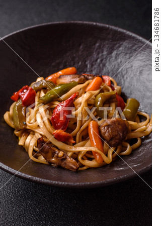 Asian food, noodles with vegetables, vegetarian dish with spicy sauce. Noodles with vegetables Asian food, noodles with vegetables, vegetarian dish with spicy sauce. Noodles with vegetables 134681786
