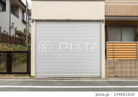 A closeup shot of automatic metal roller door used in factory, storage, garage, and industrial warehouse. The corrugated and foldable metal sheet offer space saving and provide urban and rustic feel 134681816