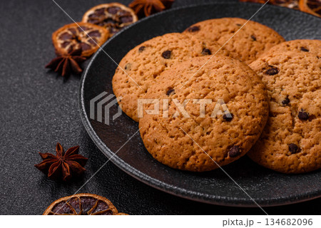 Food, oatmeal chocolate raisin cookies, dessert or breakfast pastry. Oatmeal chocolate cookies Food, oatmeal chocolate raisin cookies, dessert or breakfast pastry. Oatmeal chocolate cookies 134682096