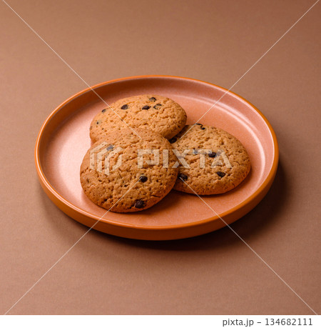 Food, oatmeal chocolate raisin cookies, dessert or breakfast pastry. Oatmeal chocolate cookies Food, oatmeal chocolate raisin cookies, dessert or breakfast pastry. Oatmeal chocolate cookies 134682111