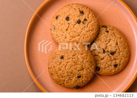 Food, oatmeal chocolate raisin cookies, dessert or breakfast pastry. Oatmeal chocolate cookies Food, oatmeal chocolate raisin cookies, dessert or breakfast pastry. Oatmeal chocolate cookies 134682113