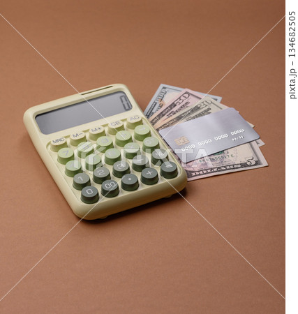 Calculator, money and expense calculations, tax form completion. Calculator, expense calculations Calculator, money and expense calculations, tax form completion. Calculator, expense calculations 134682505