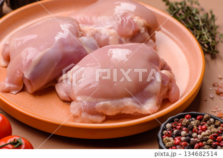 Chicken thigh fillet, skinless and boneless meat for grilling or barbecue. Chicken thigh fillet 134682514