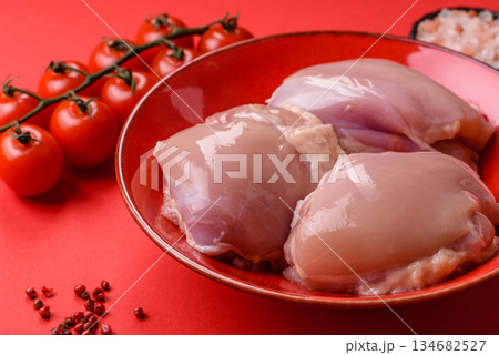 Chicken thigh fillet, skinless and boneless meat for grilling or barbecue. Chicken thigh fillet 134682527