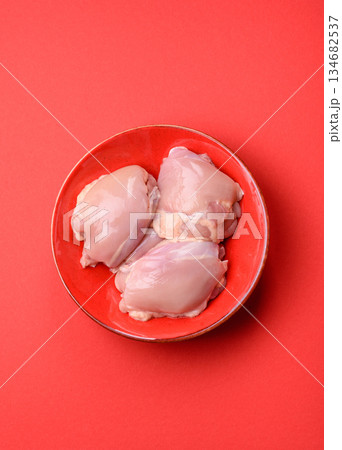 Chicken thigh fillet, skinless and boneless meat for grilling or barbecue. Chicken thigh fillet Chicken thigh fillet, skinless and boneless meat for grilling or barbecue. Chicken thigh fillet 134682537