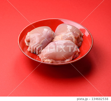 Chicken thigh fillet, skinless and boneless meat for grilling or barbecue. Chicken thigh fillet 134682538