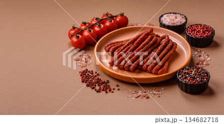 Smoked cabanossi, thin salami sausage, meat sticks, or snacks. Cabanossi sausage 134682718