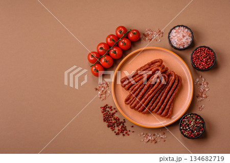 Smoked cabanossi, thin salami sausage, meat sticks, or snacks. Cabanossi sausage 134682719