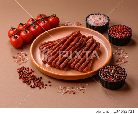 Smoked cabanossi, thin salami sausage, meat sticks, or snacks. Cabanossi sausage Smoked cabanossi, thin salami sausage, meat sticks, or snacks. Cabanossi sausage 134682721