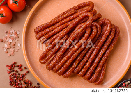 Smoked cabanossi, thin salami sausage, meat sticks, or snacks. Cabanossi sausage Smoked cabanossi, thin salami sausage, meat sticks, or snacks. Cabanossi sausage 134682723