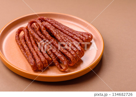 Smoked cabanossi, thin salami sausage, meat sticks, or snacks. Cabanossi sausage 134682726