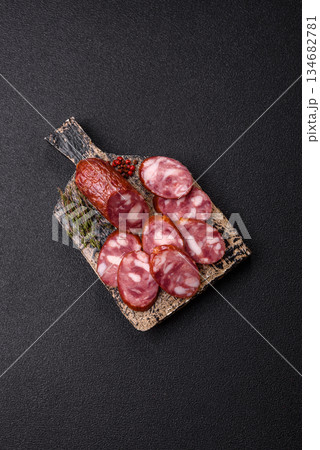 Smoked salami, thin beef or pork sausage, meat snacks. Salami sausage Smoked salami, thin beef or pork sausage, meat snacks. Salami sausage 134682781