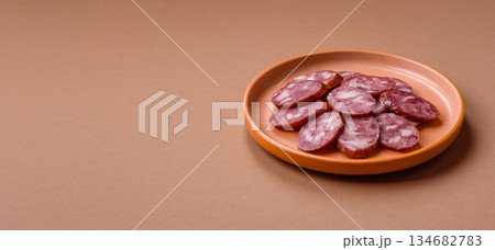 Smoked salami, thin beef or pork sausage, meat snacks. Salami sausage Smoked salami, thin beef or pork sausage, meat snacks. Salami sausage 134682783