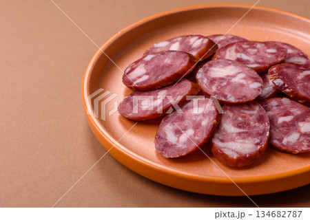 Smoked salami, thin beef or pork sausage, meat snacks. Salami sausage Smoked salami, thin beef or pork sausage, meat snacks. Salami sausage 134682787