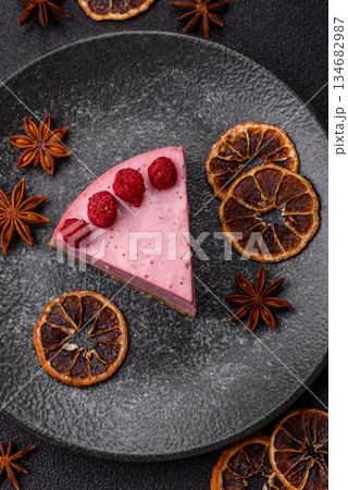Raspberry or strawberry cheesecake, a slice of sweet red cake with berries. Raspberry cheesecake Raspberry or strawberry cheesecake, a slice of sweet red cake with berries. Raspberry cheesecake 134682987