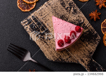 Raspberry or strawberry cheesecake, a slice of sweet red cake with berries. Raspberry cheesecake Raspberry or strawberry cheesecake, a slice of sweet red cake with berries. Raspberry cheesecake 134682998