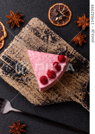 Raspberry or strawberry cheesecake, a slice of sweet red cake with berries. Raspberry cheesecake 134682999