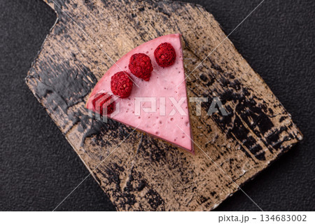 Raspberry or strawberry cheesecake, a slice of sweet red cake with berries. Raspberry cheesecake 134683002