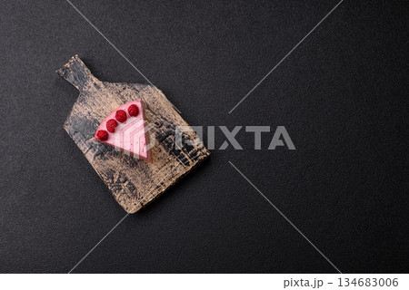 Raspberry or strawberry cheesecake, a slice of sweet red cake with berries. Raspberry cheesecake 134683006