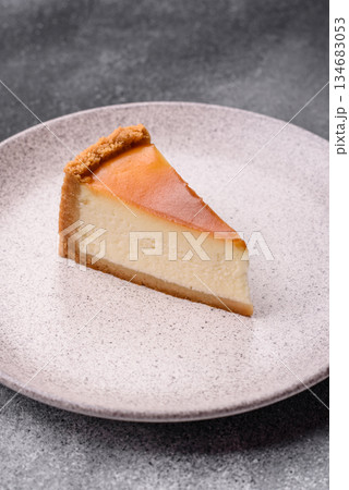 New York cheesecake, a slice of sweet pie, a classic cheesecake dessert. New York cheesecake 134683053